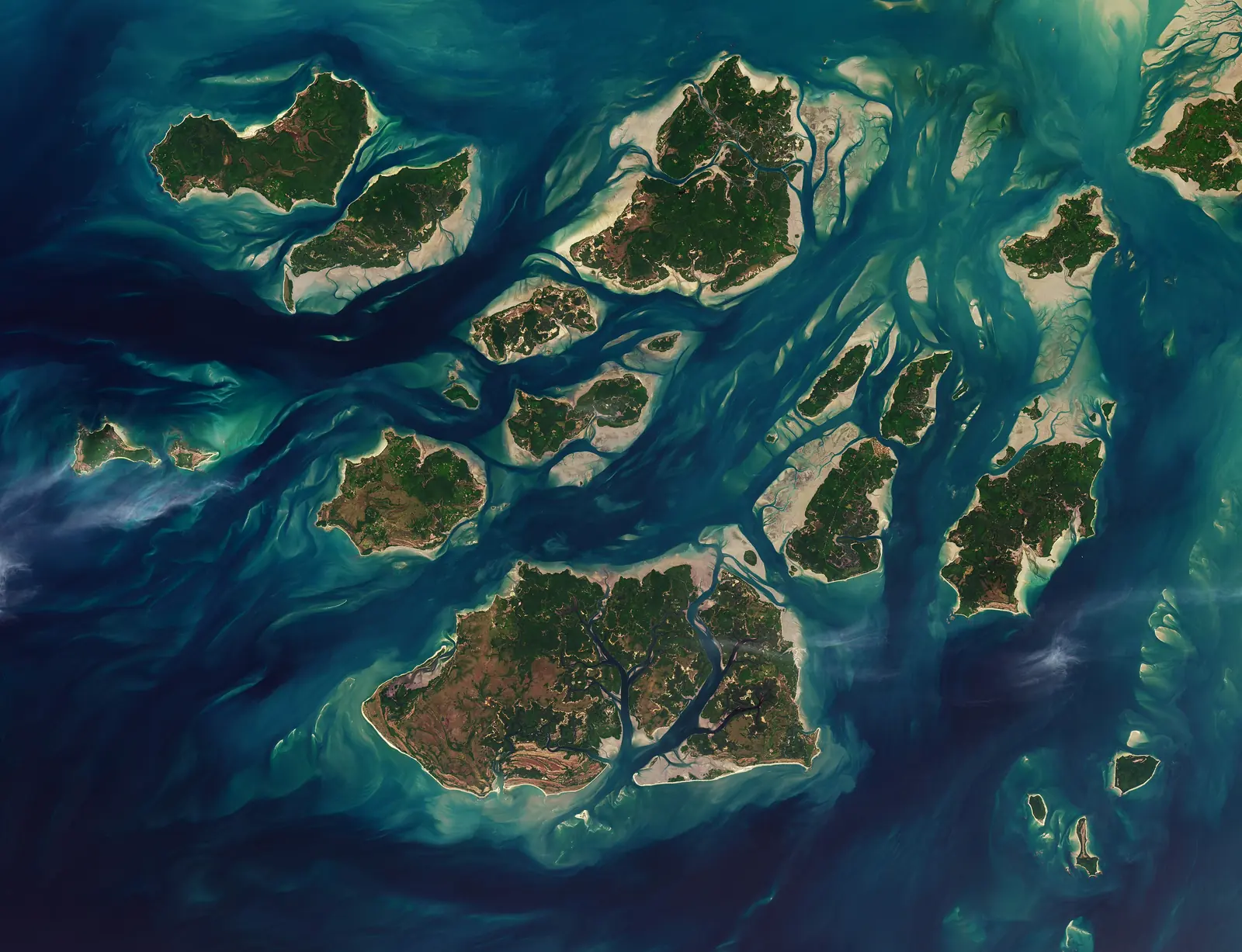 The Bijagós archipelago off the coast of Guinea-Bissau seen from space, green islands among turquoise tidal channels
